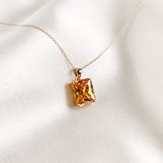 This stunning pendant is set in 14K Solid Deep Yellow Gold with AAA quality Deep Yellow Cubic Zirconia in classic prong setting. It is an unique gemstone pendant for nearly every occasion and is completely hassle-free jewelry. ◾ITEM DETAILS * Gem: Cubic Zirconia * Gem Size: 10X12mm * Gem Shape: Octagon * Gem Weight: 10.44 carats * Gold Purity: 14KT  * Gold Weight: 1.04gram * Total Weight of the Pendant: 3.13 gram The Gold purity is guaranteed and it comes with authentic 14KT gold hallmark. Since my items are handmade, they are absolutely nickel and lead free. ◾CUSTOMIZATION Gemstone customization is available and it can be substituted with a gem of your choice. Kindly message me for the same. ◾PACKAGING The Pendant comes with layers of safe and secure wrapping along with Free handmade jewe Gold Cubic Zirconia Necklace With Radiant Cut, Gold Radiant Cut Cubic Zirconia Necklaces, Gold Radiant Cut Cubic Zirconia Necklace, Yellow Gold Necklace With Radiant Cut Prong Setting, Yellow Gold Radiant Cut Necklace With Prong Setting, Gold Radiant Cut Necklace Fine Jewelry, Elegant Citrine Jewelry With Prong Setting, Elegant Cushion Cut Citrine Jewelry, Yellow Gold Radiant Cut Necklace