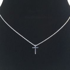 This tiny silver cross necklace is a classic addition to your layering necklaces. This minimalist necklace is also perfect by itself. The cross charm is sterling silver and measures approximately 12 mm in length or 1/2 inch. The chain is delicate looking but sturdy sterling silver. This dainty cross necklace is available in lengths from 15 - 18 inches. You may choose to add an attached extender. Your new necklace will come in a box, ready for gift giving. More Christian jewelry https://www.etsy. Tiny Cross Necklace, Dainty Cross Necklace, Cross Necklace Sideways, Cross Necklaces, Silver Cross Necklace, Sterling Silver Cross Necklace, Tiny Cross, Layering Necklaces, Small Necklace