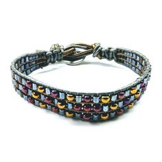 Men's ruggedly handsome and trendsetting earth-tone beaded leather wrap bracelet, crafted with hematite, brass and bronze-hued intricate needle work. Boasting a Tree of Life button loop closure fitting up to 8- 9 inches wrist, it's an essential accessory for any dapper man. Bracelet designed for men Loved by women also Earth Colored Beadwork Features macrame sections Triple row beaded bracelet Tapered beaded ends Unique one of a kind look Rustic yet elegant Tree of Life Button Closure Wear it to Adjustable Spiritual Wrap Bracelet With Spacer Beads, Adjustable Metal Wrap Bracelet Hand Wrapped, Adjustable Metal Hand-wrapped Bracelet, Adjustable Hand Wrapped Metal Wrap Bracelet, Adjustable Hand Wrapped Metal Beaded Bracelets, Bohemian Handmade Hematite Beaded Bracelets, Handmade Bohemian Hematite Beaded Bracelets, Adjustable Brown Hematite Beaded Bracelets, Adjustable Hematite Beaded Bracelets In Bohemian Style