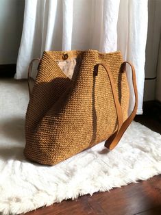 Any woman must have this bag for every fashionista. Whether you keeping it to yourself or gifting someone you care, it will be unforgettable. ✔️I made this beautiful bag from natural paper rope which is organic cotton and genuine leather in tan. ✔️The interior of the straw summer bag is fully lined with cotton and has a magnetic button. Suitable for use as shoulder bag, beach bag, travel bag or party bag. ✔️The bag has cotton lining. A lining of the appropriate color is sewn into the crochet pap Brown Straw Beach Bag For Travel, Large Capacity Crochet Pouch Bag For Vacation, Brown Crochet Bag For Vacation, Summer Brown Pouch Straw Bag, Bohemian Straw Pouch Bag With Large Capacity, Natural Handheld Crochet Bag With Large Capacity, Handheld Straw Travel Bag, Chic Crochet Straw Bag For Travel, Brown Crochet Bag For Everyday Beach Season