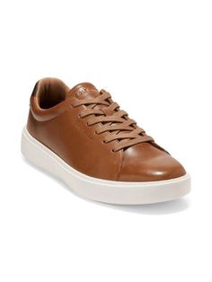 Please note: Customer feedback suggests this item runs small. Consider ordering a size up..This version of Cole Haan’s popular 'Grand Crosscourt' sneakers are a must-have for any sneaker aficionado. Made from supple, yet durable leather, they're constructed in a streamlined tennis shoe shape that will never date..Leather upper.Round toe.Lace-up vamp.Lining: Polyester.Ethylene-Vinyl Acetate (EVA) sole.Imported.Please note: Customer feedback suggests this item runs small. Consider ordering a size Synthetic Slip-on Sneakers With Gum Sole, Comfortable Brown Sneakers With Perforated Toe Box, Synthetic Plain Toe Sneakers For Sports, Synthetic Sports Sneakers, Classic Synthetic Sneakers With Gum Sole, Classic Brown Sneakers With Cushioned Footbed, Classic Plain Toe Synthetic Sneakers, Comfortable Brown Sneakers With Ortholite Insole, Comfortable Brown Plain Toe Sneakers