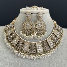 White Antique Polki Kundan necklace set/Reverse Ad Necklace/Statement necklace/Indian/Punjabi Necklace/Pakistani Jewelry/Bridal necklace/ Antique Reverse Ad Stone Necklace With Mehndi Plating Regular Size And Adjustable Stone Necklace Antique Necklace Set with dull gold finish  This is 100% Handmade jewelry. So Color, shades, texture displayed may slightly vary from the actual product due to digital image limitations. We request you to consider these minor variations. Please expect the possibili Luxury White Bollywood Temple Necklace, Silver Kundan Choker For Ceremonial Occasion, Traditional Hand Set Kundan Necklace, Ceremonial Silver Kundan Choker, Bollywood Style Necklace With Intricate Design For Eid, Heavy Kundan Necklace For Ceremonial Occasions During Eid, Bollywood Style Metal Necklace For Diwali, Eid Jewelry Sets With Tilla For Celebration, Bollywood Style Intricate Necklace For Eid