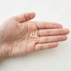 This necklace is a piece of our new collection of Allah necklace made from sterling silver and 14k gold. The collection includes different designs that suit all tastes Kufi/calligraphy, heart/rectangle/triangle shapes, tiny/big sizes. Here is the link for the full collection: https://etsy.me/2Swd0lP All the designs can be made as necklace, bracelet, and earrings. If you also want a complete set that includes a necklace, a bracelet and earrings please get in touch with us. We accept custom orders Kufi Calligraphy, Allah Necklace, Calligraphy Heart, Allah Pendant, Skin Craft, Arabic Jewelry, Islamic Jewelry, Minimal Gold, Letter Ring