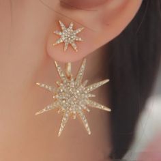 Intricate and sparkling star stud earrings are fashionably trendy and dazzling.  These would be absolutely gorgeous for a wedding, bridal party or any occasion.  Make your selection in gold and silver.  Great for those who are celestial fans! Earring Details: * COLOR:  Gold or Silver * MATERIAL:  Zinc Alloy, Cubic Zirconia, and metal ear push back posts for pierced ears * WEIGHT:  Lightweight - 6 grams (pair) * SIZE:  1.57 inches Length /  1 inch Width * INCLUDES:  Clear rubber earring backs wit Gold Star Earrings, Wedding Gifts For Friends, Formal Jewelry, Cheap Earrings, Sparkling Stars, Ear Jacket, Star Earrings Stud, Zirconia Earrings, Crystal Stud Earrings