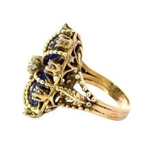 This antique ring in 14K yellow gold is regal in design, featuring a crown-like blue enamel and sparkling diamonds. Crafted with intricate details, this piece exudes a timeless elegance fit for royalty. Perfect for those seeking a vintage touch to their jewelry collection. Jewelry Style : RingMetal Type : 14K Gold Diamond : 9 Old Euro Cut , Approximately 1.0 ctwBlue EnamelApproximately 1.25" long x .80" wideRing Size : 7 : Can be sized by your local jewelerestate piece, sold as is, all weights a Vintage Diamond Enamel Ring, Vintage Blue Sapphire Ring With Diamond Accents, Victorian Sapphire Ring With 17 Jewels In 14k Gold, Blue 14k Gold Enamel Ring For Formal Events, Formal Blue Enamel Ring In 14k Gold, Yellow Gold Enamel Ring With Diamond Accents For Anniversary, Blue 14k Gold Enamel Ring For Formal Occasions, Anniversary Yellow Gold Enamel Ring With Diamond Accents, Vintage Diamond Enamel Round Ring