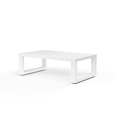 a white table sitting on top of a white floor