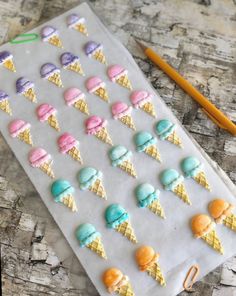 an ice cream tray with different flavors of ice cream on it and a pencil next to it