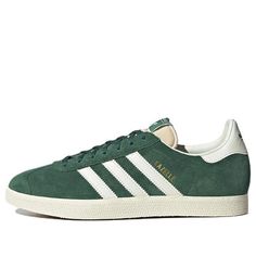 The Adidas Gazelle 'Faded Archive' is a timeless classic. Drawing inspiration from the 60s and 70s, this sneaker is perfect for those looking for a stylish, yet comfortable shoe. Crafted with a green leather upper and white accents, this shoe is sure to stand out. The iconic T-toe design and signature 3-stripes provide a classic look, while the cushioning midsole ensures comfort. Whether you're a football fan, skater, or rocker, the Adidas Gazelle 'Faded Archive' is the perfect shoe for any acti Classic Adidas Sneakers With Vulcanized Sole, Classic Green Sneakers With Vulcanized Sole, Classic Green Sneakers With Gum Sole, Classic Adidas High-top Sneakers With Rubber Sole, Classic Adidas Sneakers With Rubber Sole, Classic Adidas Lace-up High-top Sneakers, Adidas Retro Skate Shoes With Rubber Sole, Retro Adidas Skate Shoes With Rubber Sole, Retro Sneakers With White And Gum Sole