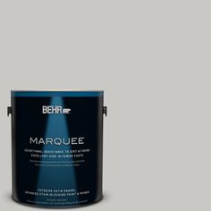 a blue paint with the words marquee on it and an empty can next to it