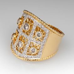 This beautiful wide band diamond ring features a pierced design and is accented with six (6), bead set, round brilliant cut diamonds and sixty-seven (67), bead set, round brilliant cut diamonds. The ring measures 19.8mm at the top, rises 2.7mm above the finger, tapering to 6.8mm wide and 1.1mm thick at the base of the shank. The ring is a size 6.5. We are not offering resizing due to the design of the ring. Luxury Multi-stone Cubic Zirconia Diamond Ring, Luxury Cubic Zirconia Multi-stone Diamond Ring, Heirloom Diamond Ring With Wide Band, Luxury Wide Band Ring With Diamond Accents For Wedding, Luxury Wide Band Diamond Ring With Diamond Cut, Luxury Wide Band Wedding Ring With Diamond Accents, Heirloom Diamond Wide Band Jewelry, Heirloom Wide Band Diamond Jewelry, Classic Jewelry With Single Cut Diamonds In Wide Band