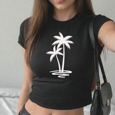 Step back into the beloved 90s era with our Classic 90s Style Women's Baby Tee, blending nostalgia with modern-day fashion. 90's baby tees were kids size shirt for women making it a belly shirt but not the crop top of the 80's.  Created for you with attention to detail and a deep commitment to your satisfaction. ✩ PRODUCT HIGHLIGHTS ✩ Enjoy the comfort of women's baby tee in solid colors made with extra lightweight, airlume-combed, ring spun cotton for the best comfort t-shirt. Ideal for precisi Casual Summer Tops With Graphic Design, Black 90s Style T-shirt For Summer, 90s Style Black T-shirt For Summer, 90s Style Black Short Sleeve Tops, Spring Vsco Streetwear Tops, Y2k Summer Tops With Screen Print, Y2k Style Screen Print Summer Tops, Y2k Style Screen Print Tops For Summer, Y2k Summer Screen Print Tops