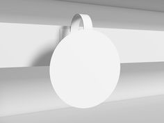 a white round object hanging from the side of a wall