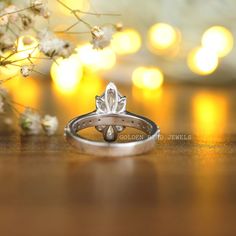 a wedding ring sitting on top of a wooden table