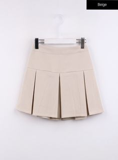 solid-pleated-mini-skirt-cj425 / Beige Pleated Mini Skort For School, Classic Cotton Mini Pleated Skirt, Classic Cotton Pleated Mini Skirt, Classic Short Length Pleated Skort, School Uniform Mini Skirt With Pleats, Trendy Short Tennis Skirt For School, Preppy Pleated Mini Length Bottoms, School Uniform Mini Skirt For Summer, Cotton Pleated Skort For School Uniform