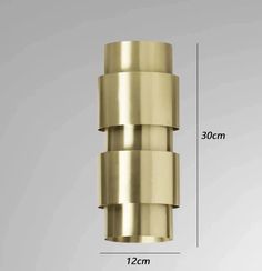 an image of a brass colored light fixture with measurements for the size and width in front of it