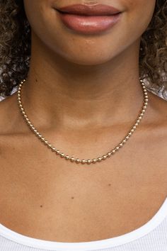 Featuring an endless chain of luminous rounded gold beads, this necklace is sure to be a go-to! STYLE TIP: Pair this beautiful necklace with the Erin Necklace for an effortless look. 18k gold-plated sterling silver Adjustable between 15" - 17" 4mm beads