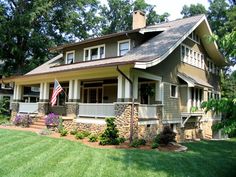 a house with an american flag on the front porch