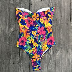 Item Type: One Pieces Sport Type: Swim Material: Polyester Material: Spandex Gender: Women Pattern Type: Print season: spring summer autumn winter color: black decoration: swimming suit for women style: beachwear size: S, M, L, XL suitable: bathing suit women Design: one piece swimsuit Stretch Floral Print Swimwear For Surfing, Beachy Stretch Swimwear With Floral Print, Beachy Swimwear With Floral Print And Stretch, Multicolor Stretch Swimwear For Vacation, Stretch Multicolor Swimwear For Beach, Fitted Multicolor One-piece For Sunbathing, Stretch Floral Print Swimwear For Beach Season, Floral Print Stretch Tankini For Sunbathing, Stretch Floral Print Tankini For Sunbathing