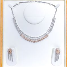 Elevate your look with our Chic Rose Gold Diamond Necklace Set. Crafted from 18k rose and white gold, this set features round diamonds weighing 9.97 carats with F-G color and VS clarity. The necklace measures 17.25 inches and the matching earrings are included, measuring 1.9 inches. The set has a hook lock with adjustable links and screw back earrings. The item weight is 59.0 grams. PRODUCT DETAILS Gold Purity(karat): 18k Item Weight(grams): 59.0 Item Finish: Rose + White Gold Stone: Diamond Dia Rose Gold Diamond Necklace, Gold Chic, 18k Gold Necklace, Diamond Necklace Set, Gold Diamond Necklace, Gold Necklace Set, Gold Stone, Screw Back Earrings, Rose Gold Diamonds