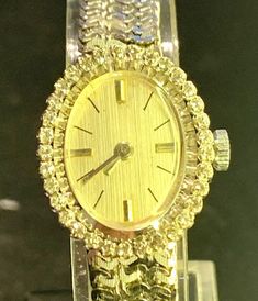 Clasic Art Deco style ladies watch. Please note, due to the hew of the photos, the watch is not yellow gold but white gold. Studied with brilliant cut white diamonds on the bezel, in total 34 stones apr. 1ct diamonds. 14ct white gold case and bracelet. The watch is fitted with 17 jewels Olivino Swiss movement, working perfectly well. The case and bracelet are made by Thusal, Switzerland with the fine quality of diamonds. The case measures 22.5mm by 18mm without the crown. The watch bracelet meas Yellow Gold Diamond Watch, Elegant Gold Diamond Watch With Single Cut Diamonds, Gold Diamond Accented Watch For Evening, Gold Diamond Watch With Diamond Accents For Evening, Gold Evening Watches With Diamond Accents, Diamond Watches With 17 Jewels For Evening, Gold Watches With Diamond Accents For Evening, Gold Diamond-accented Watch For Evening, Yellow Gold Diamond Jewelry For Wedding