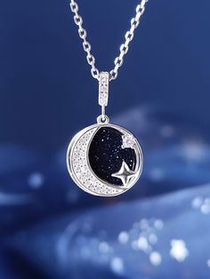 The double layered pendant is made of solid 925 sterling silver plated 18k gold. The necklace comes in the shape a round charm with a half moon and the stars made of bright and shiny clear swarovski. The back sandstone is a shiny dark blue stone with a bright clear dust inside that seems to see a starry sky. Pendant is also available in silver, 18k gold or rose gold color. You can choose your favorite color from the dropdown menu. Product details: Material: 925 Sterling Silver Colour: 18k Gold, Silver, Rose Gold Size: 13mm * 13mm Chain lenght: 45+5cm adjustable From A Court of Thorns and Roses by Sarah J. Maas, ©2015. Created with permission of Writers House LLC acting as agent for the author. Silver Celestial Necklace For Her, Celestial Sterling Silver Charm Necklaces With Clavicle Chain, Sterling Silver Celestial Charm Necklaces, Sterling Silver Celestial Charm Necklaces With Clavicle Chain, Court Of Thorns And Roses, Night Court, Silver Colour, Moon Necklace, Starry Sky