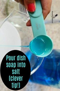 a person holding a spoon in their hand with soap on it and the words pour dish soap into salt clever tip