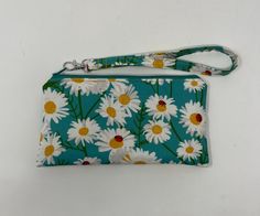 This handmade wristlet measures 8 x 4.5 inches.  It has one internal zipper pocket, card slots, and a removable strap.  The fabric is cotton and it is washable. I donate 10% of each sale to Polycystic Kidney Disease in honor of my kidney donor. Casual Rectangular Wristlet With Zipper Pouch, Casual Daily Use Wristlet With Zipper Pouch, Adjustable Wristlet With Zipper Pouch For Daily Use, Adjustable Zipper Pouch Wristlet For Daily Use, Red Wristlet With Zipper, Adjustable Rectangular Red Wristlet, Kidney Donor, Handmade Wristlet, Pocket Card