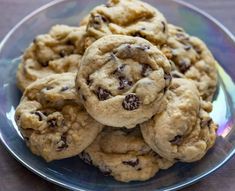 a plate full of chocolate chip cookies on a table