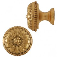 an antique brass cabinet door knob with a flower design on the front and back side