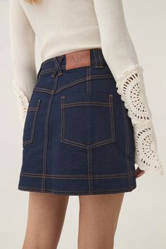 Resonance Denim Mini Skirt | Indigo | Aje – Aje ROW Jumper Denim, Mini Jean Skirt, Jumper Pants, Stretch Denim Fabric, Indigo Colour, Knit Jumpsuit, Denim Blazer, Fitted Style, Denim Accessories