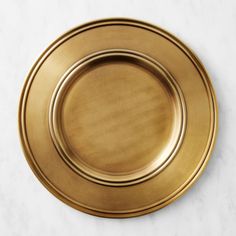 a gold plate sitting on top of a white counter