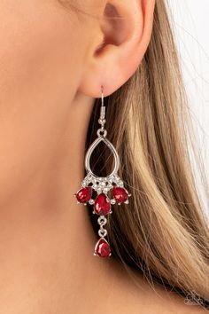 A solitaire red teardrop rhinestone sways from the bottom of a fan of red rhinestone teardrops that flares out from a white rhinestone floral accent at the bottom of an airy silver frame, resulting in a modern chandelier. Earring attaches to a standard fishhook fitting.

 Sold as one pair of earrings. Red Rhinestone Earrings, Paparazzi Jewelry Images, Chandelier Earring, Formal Earrings, Brown Bracelet, Mixed Metal Jewelry, Fish Hook Earrings, Paparazzi Accessories, Red Earrings