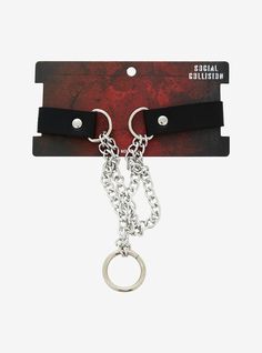 Look like a total baddie with this choker on! It features double chains leading to an O-ring at the center  and a faux leather strap on the back that's adjustable.15"Nickel-free alloy; polyurethaneAdjustableImported Adjustable Black Metal Chain Belt, Adjustable Edgy Chain Belt, Edgy Adjustable Metal Choker, Edgy Adjustable Chain Strap Jewelry, Edgy Metal Choker, Adjustable Metal Edgy Choker, Edgy Metal Chain Link Choker, Edgy Adjustable Chain Choker, Trendy Chain Choker For Concerts