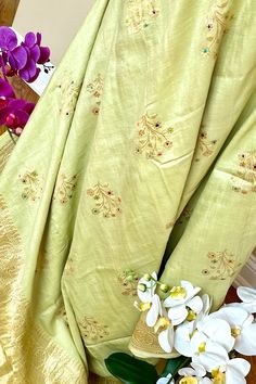 This exquisite tussar georgette silk saree in light mint green color is nothing but a saree lovers dream. The soft flowing textured tussar georgette silk has a beautiful drape. This saree is nothing but a handcrafted luxury! Approximate Length 6.25 - 6.50 mtrs (inclusive of blouse length)Approximate Height - 46 - 50” Saree comes with fall, picot and tassels done when applicable . Blouse piece is cut. Approximate weight - 1.3 lbs Kindly Note : The colors you see on your device may vary due to the color reproduction, brightness and resolution of individual devices. If you'd like more clarity before your purchase, please contact our support team. ***The model has partially draped the saree on the pallu portion to show the color, feel and flow of the saree. Blouse is not part of the sale*** Green Slub Silk Traditional Wear With Resham Embroidery, Designer Green Slub Silk Dupatta, Green Tussar Silk Pre-draped Saree With Dupatta, Traditional Green Slub Silk Pre-draped Saree, Pista Green Slub Silk Dupatta With Resham Embroidery, Green Tussar Silk Pre-draped Saree, Festive Green Tissue Silk Pre-draped Saree, Green Slub Silk Blouse Piece With Zari Work, Green Anarkali Slub Silk Dupatta