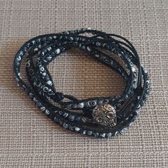 This Is In Handmade, Handcrafted Leather And Beaded Wrap Bracelet. This Is Brand New And Has Never Been Worn. The Bracelet Has Black/White Beads On Black Leather. There Are Three Closure Holes And A Sugar Skull Button Closure. This Is 39" Long And It Is 35"-37" Around The Wrist. I Will Combine Shipping. Thanks For Looking! Hand Wrapped Black Beaded Bracelets For Beach, Hand Wrapped Black Jewelry For Beach, Hand Wrapped Black Beach Jewelry, Black Hand Wrapped Beaded Bracelets For Festival, Hand Wrapped Black Beaded Bracelets For Festivals, Festival Hand-wrapped Black Beaded Bracelets, Black Multi-strand Bohemian Bracelets, Black Hand Wrapped Festival Bracelets, Black Hand Wrapped Bracelets For Festivals