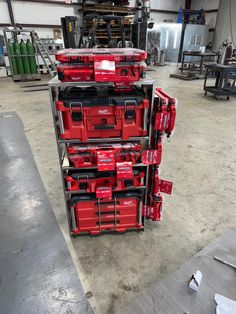 several red tool boxes stacked on top of each other