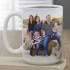 a coffee mug with a family photo on it