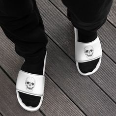 Step into a world of style and comfort with our Black Skull White Slides for Men. These striking slides are designed to make a bold fashion statement while ensuring your feet stay comfortable all day long. The cushioned upper strap and textured footbed make these slides an excellent choice for the season's activities. 🦴 Cushioned Comfort: Our men's slides feature a cushioned footbed that provides superior comfort with each step. Whether you're relaxing at home or heading out, these slides are p Comfortable Cushioned Slides For Streetwear, Comfortable Slides With Cushioned Footbed For Streetwear, Slide Slippers For Streetwear, Streetwear Open Toe Slides With Textured Footbed, Casual Slip-resistant Slides For Leisure, Comfortable Open Toe Slides For Streetwear, Cushioned Slide Slippers For Streetwear, Textured Slip-on Slides For Streetwear, Cushioned Slip-on Slides For Streetwear