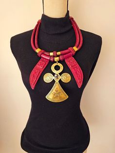 Very detailed handcrafted leather necklace with brass Ankh pendant. Detailed with extra leather  pieces to make it pop more.   Can be worn by men and women Gye Nyame Earrings, Fulani Earrings, Ankh Pendant, Coral Jewelry, Leather Pieces, Shell Earrings, Handcrafted Leather, Color Combo, Leather Necklace