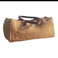 this beautful handmade bag is crocheted from %100 raffia in natural tone  and its very lightweight. Bohemian Satchel Straw Bag With Large Capacity, Chic Jute Crochet Bag With Leather Handles, Chic Crochet Jute Bag With Leather Handles, Bohemian Rectangular Satchel For Summer, Elegant Woven Straw Tote Bag, Trendy Beige Tote Weekender Bag, Bohemian Handheld Straw Bag With Large Capacity, Elegant Natural Straw Tote Bag, Eco-friendly Handheld Crochet Bag With Large Capacity