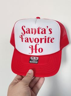 Elevate your holiday spirit and add a dash of fun to your winter wardrobe with our festive Holiday Truckers Hat! This one-of-a-kind accessory is the perfect blend of style and comfort, making it a must-have for all your seasonal adventures. 🎄 Handcrafted with Love: Each holiday trucker hat is meticulously crafted with attention to detail. Our team of skilled artisans ensures that you receive a high-quality product that you'll be proud to show off during the holidays. 🌟 Unique Design: Our holiday-themed trucker hat features a unique and eye-catching design that encapsulates the magic of the season. Whether you're hitting the slopes, gathering around the campfire, or just running errands, this hat will keep you in the festive spirit. 🧢 Comfortable Fit: Made with premium materials, our tru Novelty Red Trucker Hat, Casual White Hat For Holiday, Casual White Holiday Hat, White Snapback Trucker Hat For Winter, Red Winter Hat As A Gift, Red Winter Hats For Gifts, Casual White Christmas Hat, Casual Christmas Hat, Casual Christmas Hat One Size Fits Most