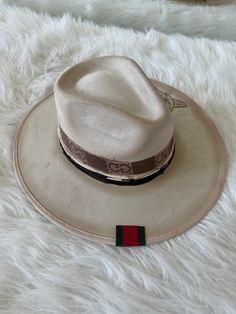 Our love of hats continues with this incredible handmade original: meet the Luxe Banded Hat in ivory. A hat this good needs to be worn as much as possible and with every single outfit! Hand made by artisans, incredible quality, pure suede, genuine leather trim around the crown, iconic trim, the list goes on! Will ship 12/1. The best part? It's super structured with an elastic band on the inside that will fit EVERYONE. Btw never taking this hat off. These hats are a limited edition. THE HAT:-Rancher style hat, pure suede-Stiff brim with elastic hat band on the inside-- OMG YES-Classic, beautiful ivory-Genuine leather trim and chain-- talk about luxe-Incredible quality-Holds it's shape amazingly 22.5 inches 3.5 inch brim // 4 inch crown100% suede Mens Hats Fashion, Suede Hat, Mens Hats, Hats Fashion, Hat Band, The Crown, Leather Trim, The List, Hat Fashion