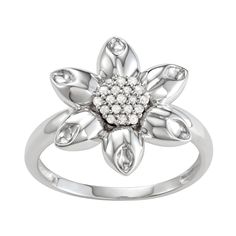 This sterling silver ring featuring a flower shape with 1/10 C.T. diamonds gives you a sparkling look.RING DETAILS Width: 16.10 mm. Metal: sterling silver Plating: rhodium Finish: polished  DIAMOND DETAILS Total weight 1/10 c.t. Shape: round Color: white Color grade: H,I Clarity: I2,I3 Setting: prong Diamond weights are approximate. Diamond total weights may vary between .01 and .08 ct. Some diamonds have fewer than 17 facets.Diamond equivalent carat (ct.) Total Weight (T.W.) represents the appr Flower Shaped Rings With Diamond Accents For Anniversary, Diamond Flower Promise Ring, Flower Shaped Anniversary Rings With Diamond Accents, Anniversary Flower Shaped Rings With Diamond Accents, Anniversary Flower-shaped Rings With Diamond Accents, Diamond Flower Ring With Diamond Accents, Flower Ring With Diamond Accents For Anniversary, Flower Shaped Diamond White Ring With Diamond Accents, White Diamond Flower-shaped Ring With Accents