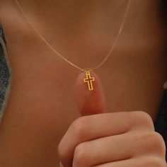 Delicately understated, the Gold Tiny Cross Necklace embodies simplicity and elegance, making it an ideal present for cherished individuals. Adorn it with self-assuredness, embracing its essence as a representation of both strength and spiritual connection. This classic design is perfect for any occasion, from casual to dressy. PRODUCT DETAILS: Material: 14K Solid Gold Choice of Gold Color: Yellow Gold, Rose Gold, White Gold Pendant Height: 12 mm Pendant Width: 0.6 mm Adjustable Length Closure: Small Cross Necklace, Tiny Cross Necklace, Dainty Cross Necklace, Cross Necklace Women, Necklace Christian, Crucifix Necklace, Tiny Cross, Christian Necklace, Gold Cross Necklace