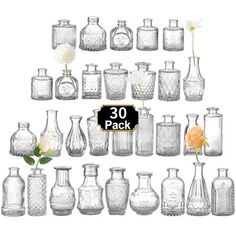 an assortment of glass vases with flowers in them and the number 30 on each