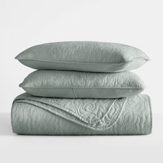 three pillows stacked on top of each other