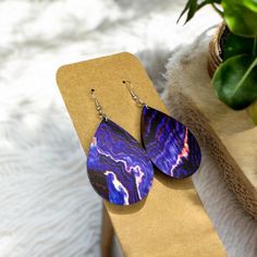 Beautiful Purple Geode Earrings!  These are lightweight. The pendant measures 2 inches long. A perfect length for most!  The wood is printed/ painted on both sides of the earring, then laser cut into a tear drop shape for a unique finish.  Handmade with hypoallergenic hardware with three different color options-  Silver , Bronze , & Rose Gold  These are perfect for all gem lovers!  Great gift for birthdays, moms, teachers, daughters, wives.  *Please message me with any questions/ concerns! I wil Hypoallergenic Teardrop Plug Earrings Gift, Purple Plug Earrings For Pierced Ears As A Gift, Nickel-free Purple Earrings As Gift, Purple Nickel-free Earrings For Gift, Purple Plug Earrings As Gift, Purple Earrings For Pierced Ears Gift, Purple Ear Wire Earrings As Gift, Purple Ear Wire Earrings For Gift, Purple Dangle Teardrop Earrings Gift