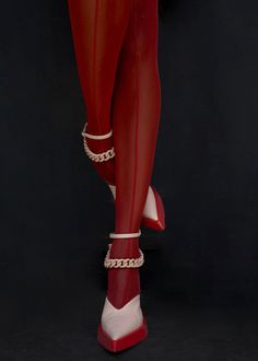 a woman in red stockings and high heels with chains on her ankles, standing against a black background