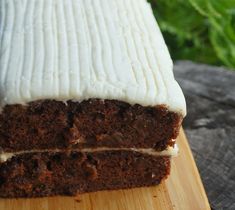 a piece of cake sitting on top of a wooden cutting board