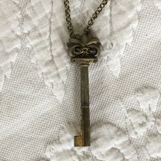 "Vintage Decorative Key on Antiqued Gold Brass Chain Necklace. Lovely Hanging Key Necklace. Lobster Claw Clasp. This necklace was just made and is in good shape. Size: Chain: 28\" Key Ornament: 3/4\" X 2 3/8\" For other jewelry and vintage items see: www.VeryVictorianStudio.etsy.com For sewing related items see my other shop: www.SewingRoomStore.etsy.com Thank you for looking!" Vintage Pendant Jewelry With Keys, Vintage Gold Jewelry With Keys, Vintage Metal Jewelry With Keys Detail, Vintage Metal Jewelry With Keys, Vintage Metal Key Jewelry, Gold Brass Necklace With Keys, Vintage Gold Key Necklace, Vintage Gold Necklaces With Keys, Key Ornament